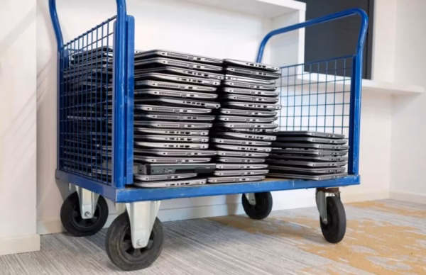 Cart loaded with laptops for business computer recycling