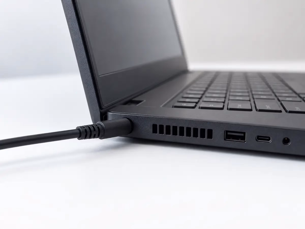 Windows business laptop showing a recovery and troubleshooting interface on a clean white desk.